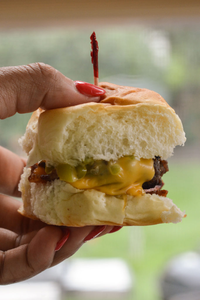 Hatch Green Chile Sliders: sweet Hawaiian roll, with a mini hamburger patty, roasted Hatch Green Chilies, sweet sautéed onions, crisp bacon, and cheese. 