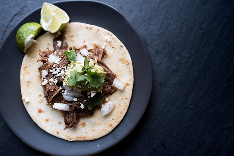 This slow cooker beef barbacoa recipe comes together in 5 minutes and cooks all day or till tender and falling apart. Dinner & leftovers will be delicious! from FirstandFull.com