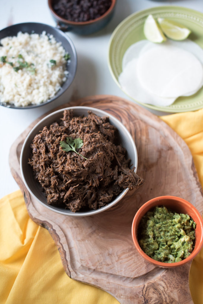 This slow cooker beef barbacoa recipe comes together in 5 minutes and cooks all day or till tender and falling apart. Dinner & leftovers will be delicious! from FirstandFull.com