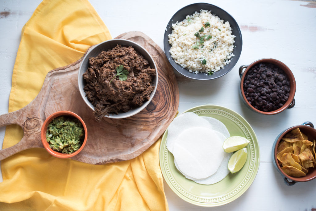 This slow cooker beef barbacoa recipe comes together in 5 minutes and cooks all day or till tender and falling apart. Dinner & leftovers will be delicious! from FirstandFull.com