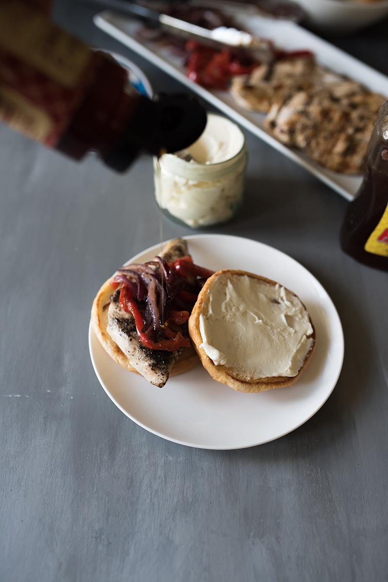 The best grilled chicken sandwich you will EVER have. Tender + juicy, grilled chicken breast, sautéed peppers & onions with a delicious cream cheese spread.