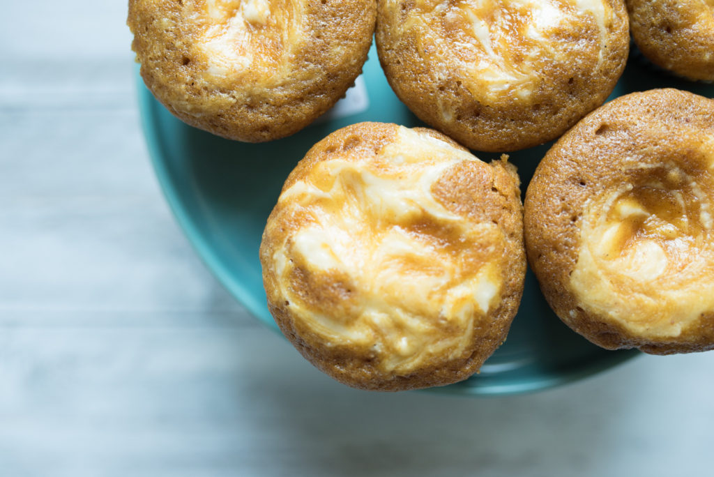 Pumpkin Cream Cheese Muffins: warm cinnamon and nutmeg, rich cream cheese swirled on top, + the ultimate taste of fall-- pumpkin! Similar to Starbucks Original.