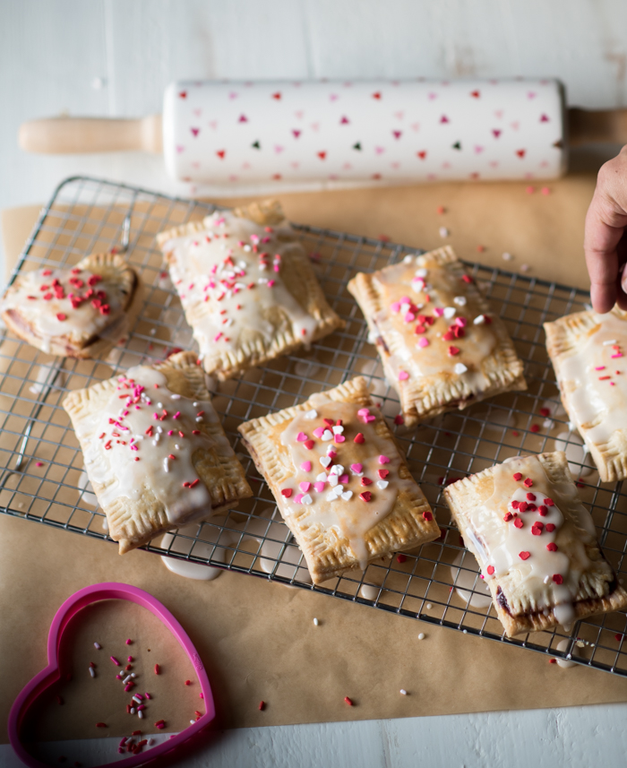 These homemade pop-tarts are flavorful and made with REAL ingredients. I stuck with a homemade pie crust, easy cherry berry jam and light glaze. 