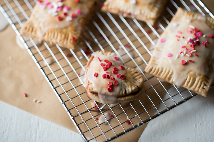 These homemade pop-tarts are flavorful and made with REAL ingredients. I stuck with a homemade pie crust, easy cherry berry jam and light glaze. 