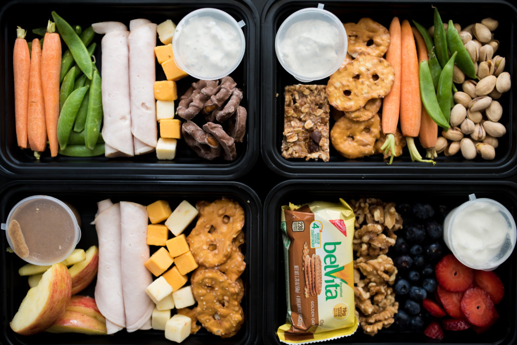 Looking for healthier snack options? Try one of these 4 Healthy Snack Box Ideas. For less than $10 and 30 minutes or less, you can have easy nutritious snack/ lunch boxes waiting ready to enjoy at a moment's notice! 