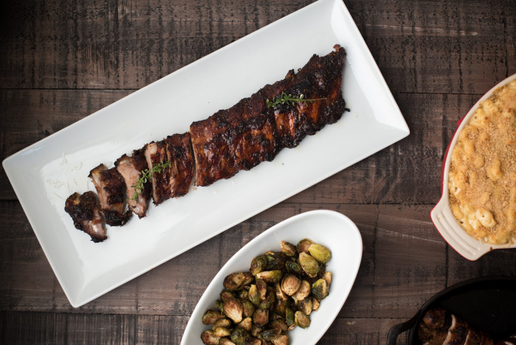 These Italian Honey baked ribs are rubbed down with a delicious dry rub and smeared with crushed garlic. They're baked till tender + brushed with honey to finish. | Firstandfull.com