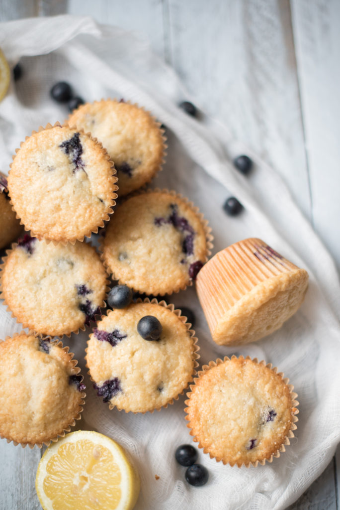 Blueberry Lemon Muffins bursting with fresh blue berries, a light lemon flavor tucked in the fluffiest muffin! The ULTIMATE breakfast/ brunch muffin!