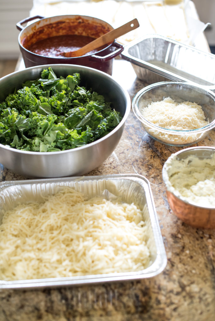 Vegetarian spinach lasagna recipe; layers stuffed with spinach and kale, a savory ricotta, and layered with mozzarella cheese. Make one for the freezer for an easy weeknight meal. 