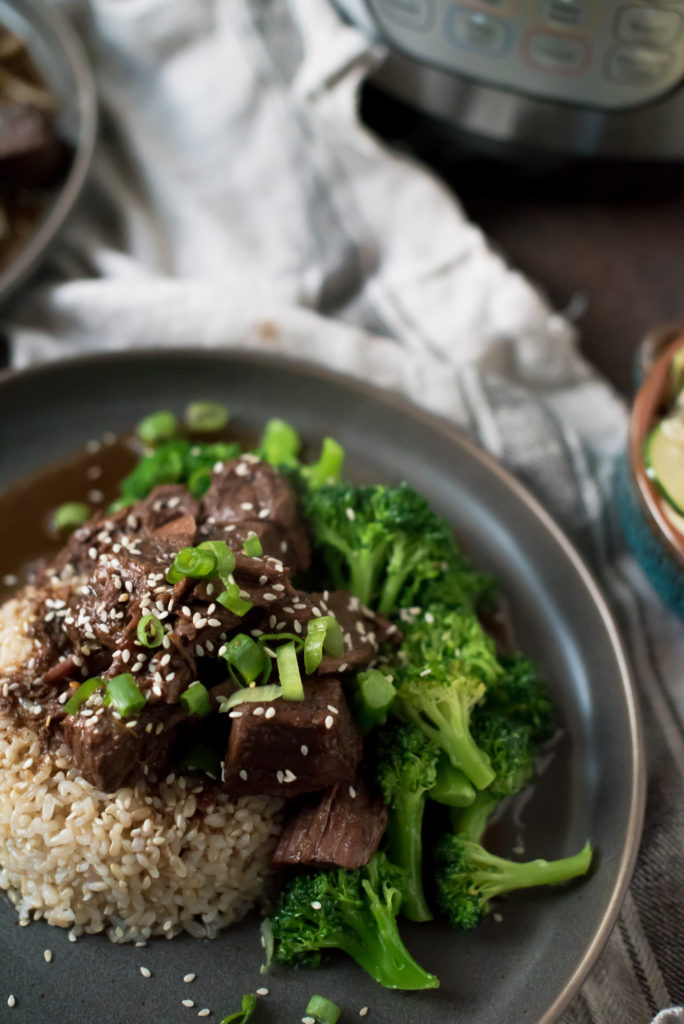 This amazing Chili Garlic Beef NEEDS to be added to your weeknight meal rotation. It's savory, a little spicy and perfect served on rice with steamed veggies. It's made in the instant pot but slow cooker instructions included.