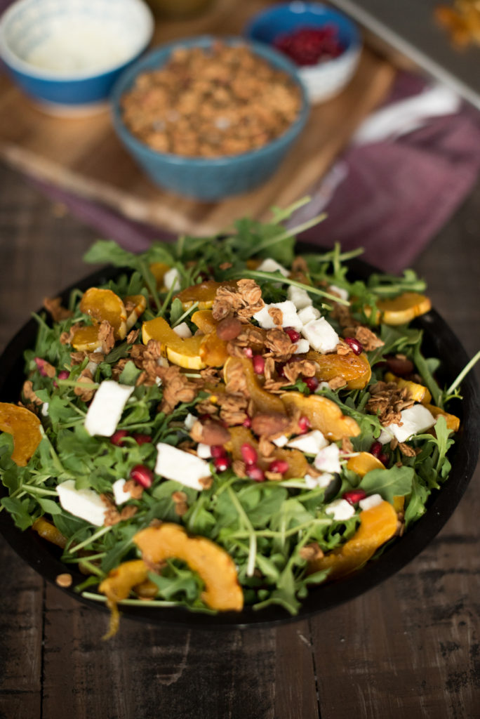 Delicious Fall Inspired Salad: Roasted Delicata Maple Salad with roasted squash, pomegranate, feta, granola, and a delicious apple cider vinaigrette. 