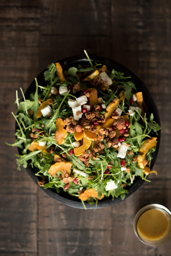 Delicious Fall Inspired Salad: Roasted Delicata Maple Salad with roasted squash, pomegranate, feta, granola, and a delicious apple cider vinaigrette. 