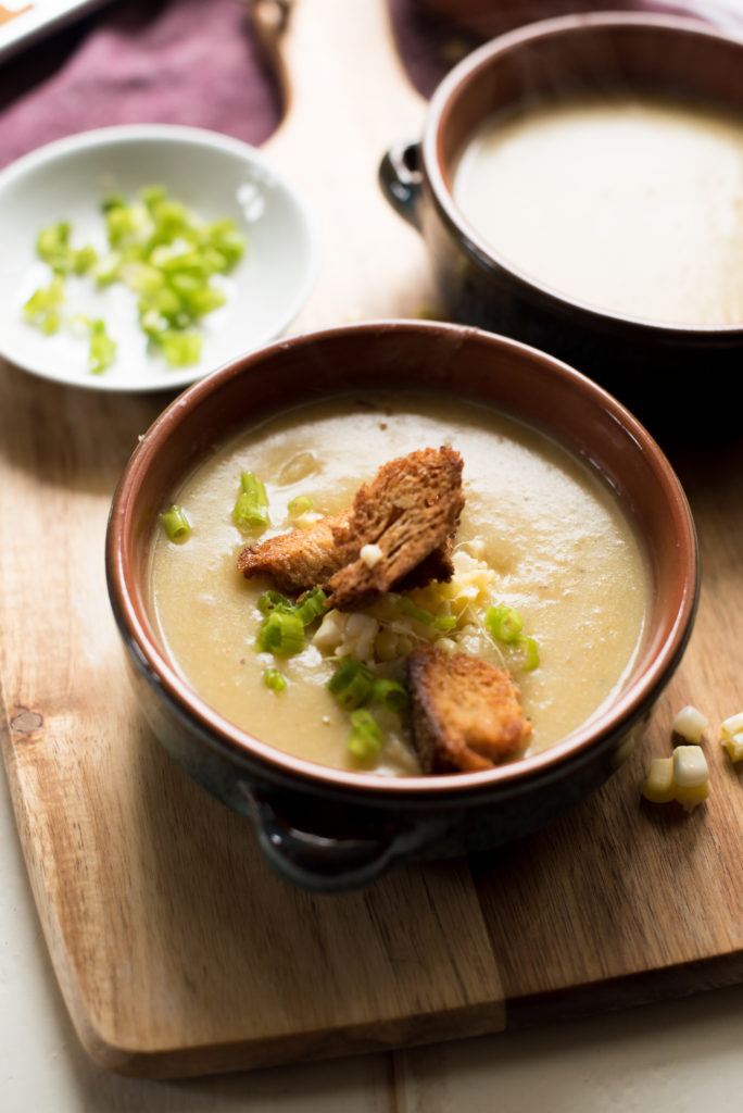 This Creamy corn and potato chowder is an easy and delicious soup recipe without the dairy! The garlicky croutons (recipe included) add the perfect crunch.  