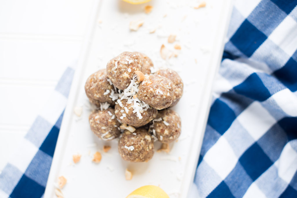 The perfect portable snack: Lemon Cookie Bliss Balls sweetened with dates and made with the perfect combination of nuts and coconut flakes.