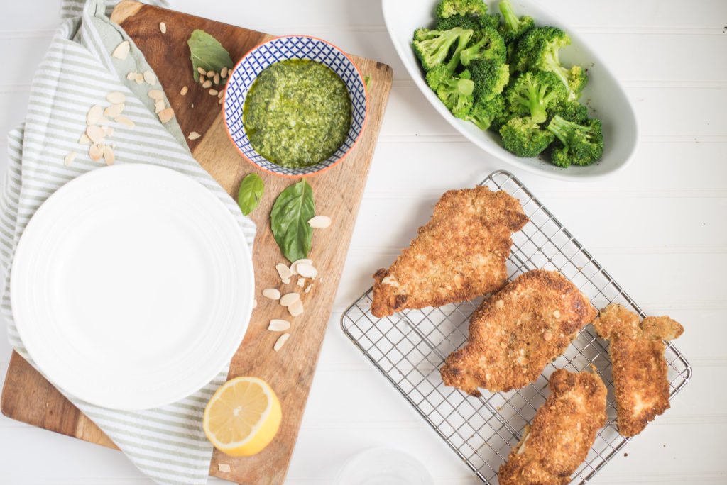 Almond Crusted Chicken Cutlets with Pesto: The nutty flavor from the almonds is slight, but when paired with the garlicky, citrusy pesto it just works! If your family is fond of chicken parmesan, they will adore this recipe for crispy almond crusted chicken and lemon- basil pesto.