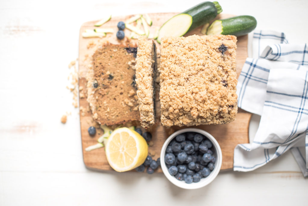 A healthier Zucchini Bread recipe topped with a delicious, crunchy streusel topping. Just sweet enough, moist, and full of flavor-- everyone will love this zucchini bread!