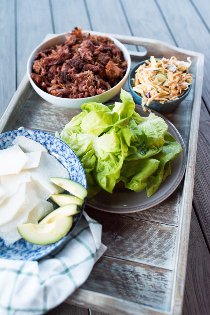 This Crispy Pulled Pork Dinner comes together in less than 10 minutes. Whole30 Compliant pulled pork, seasoned with southwestern spices, loaded in crisp lettuce cups topped with my signature creamy chipotle slaw make for a delicious meal. Clean eating made tasty and easy! 