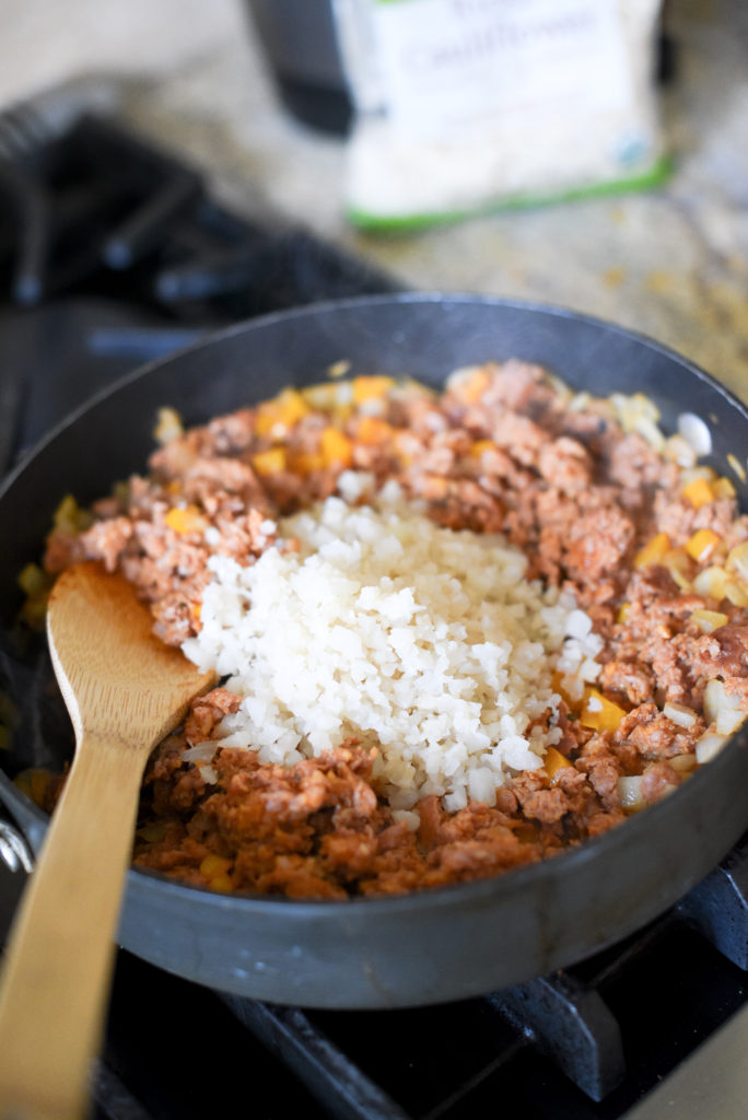 Enchilada Stuffed Poblano Peppers: Fire roasted poblano peppers, deseeded and stuffed with a delicious chorizo filling packed with onions, garlic, bell peppers, and cauliflower rice. They are then nestled into a smoky enchilada sauce and baked till bubbly.