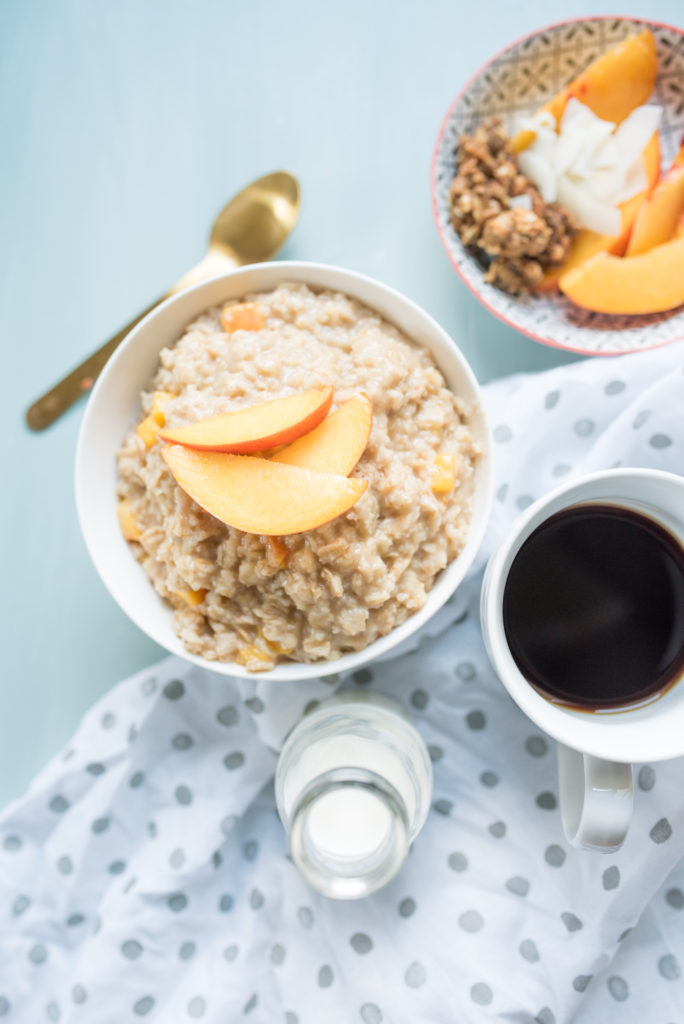 This Peaches and Cream Oatmeal is a decadent breakfast in a bowl. Sweet and creamy oatmeal with ripe peaches sautéed in brown sugar and a healthy drizzle of cream at the end.