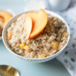 Sweet and Creamy oatmeal with ripe peaches sautéed in brown sugar and a healthy drizzle of cream at the end. A decadent breakfast in a bowl. 